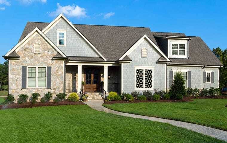 The exterior of a home with a large front yard in Colleyville.