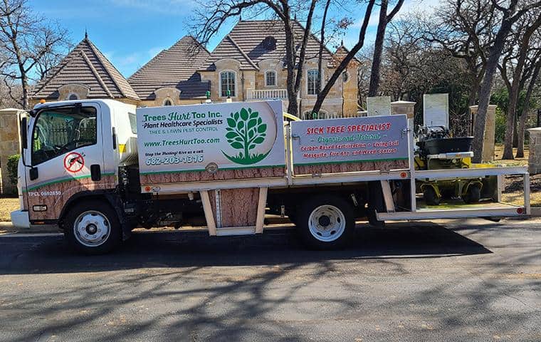 A truck belonging to Total Package Service Inc. is parked in front of a house.